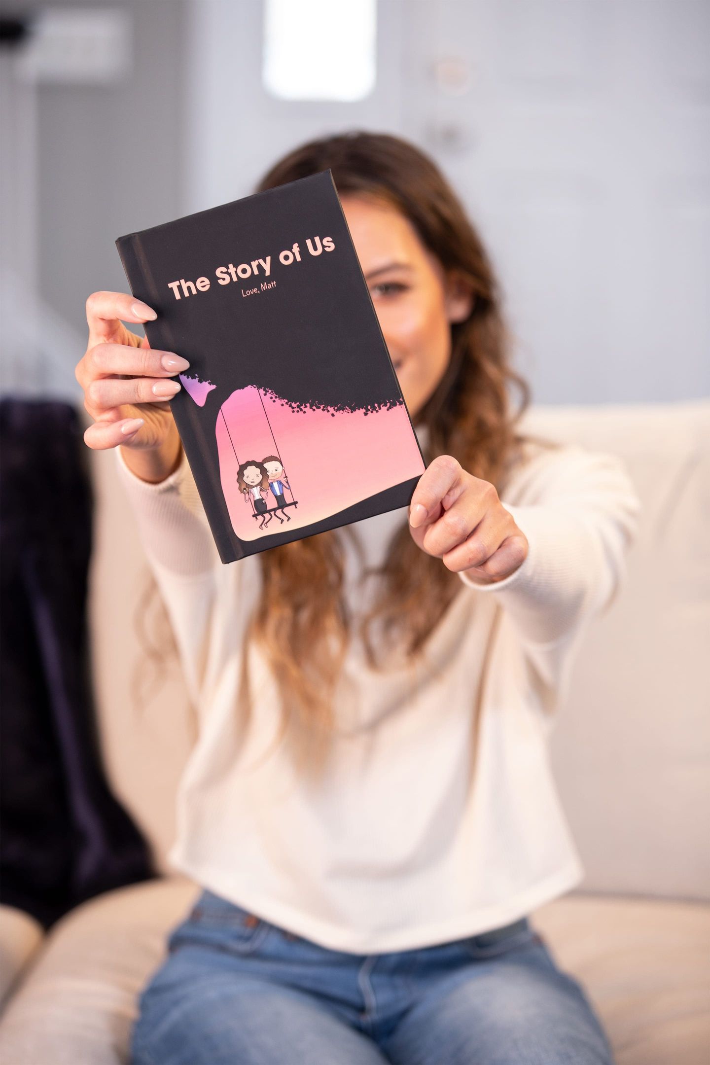 Woman holding her finished LoveBook